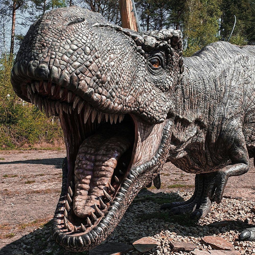 A close-up of a large T-Rex dinosaur model