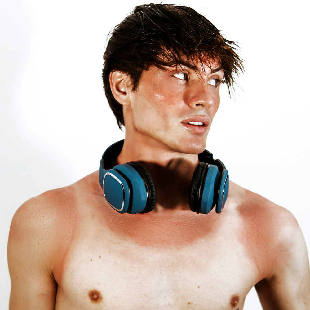 A sunburnt man with headphones